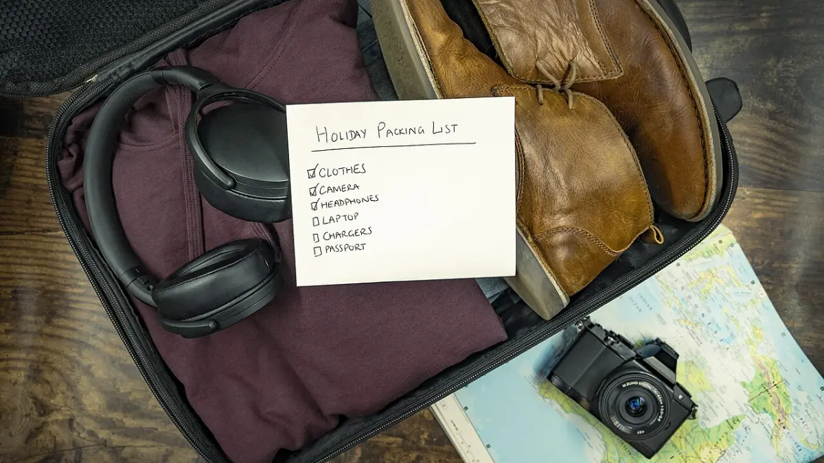 An open suitcase with a packing list
